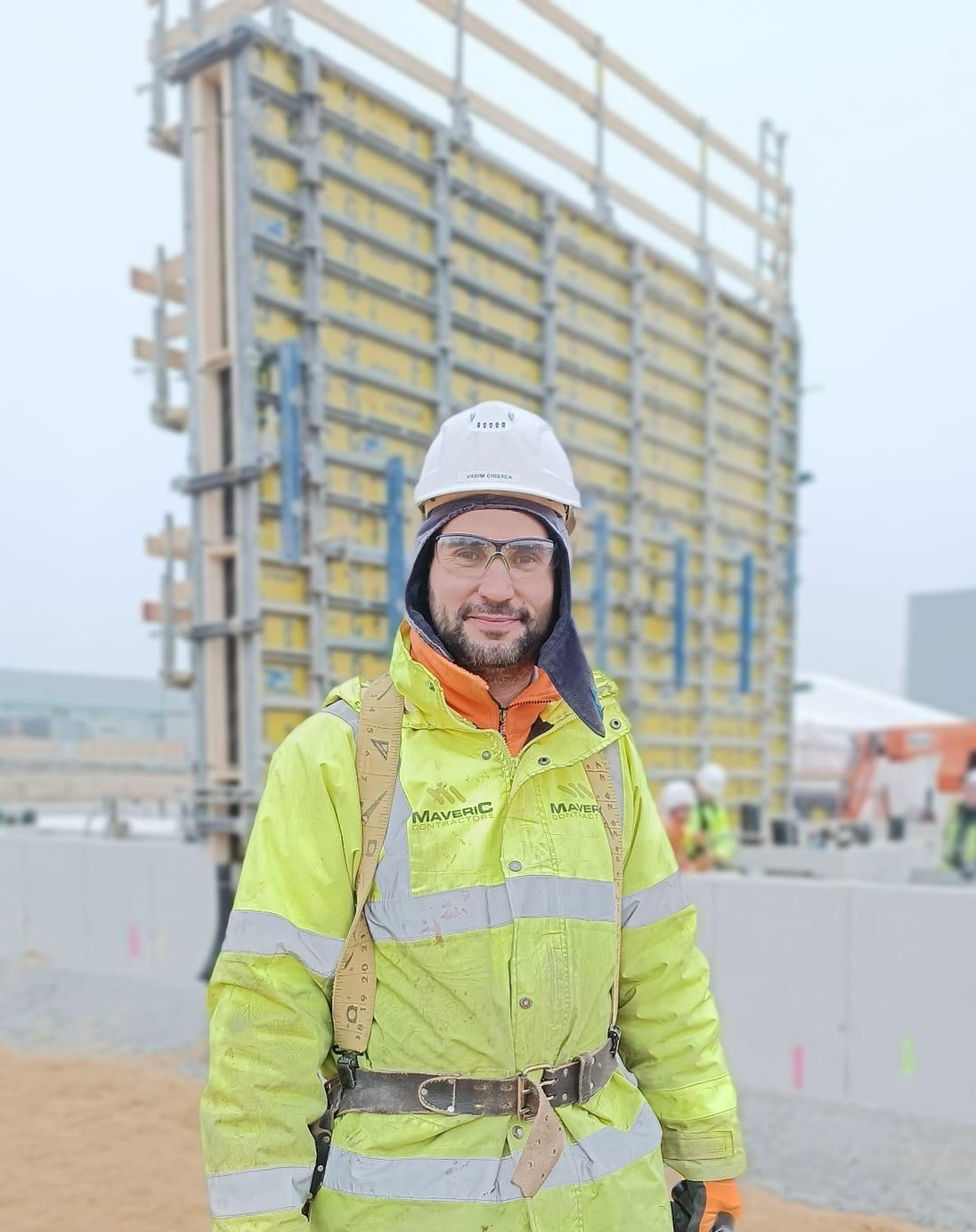 Maveric operative wearing site PPE in front of concrete formwork.