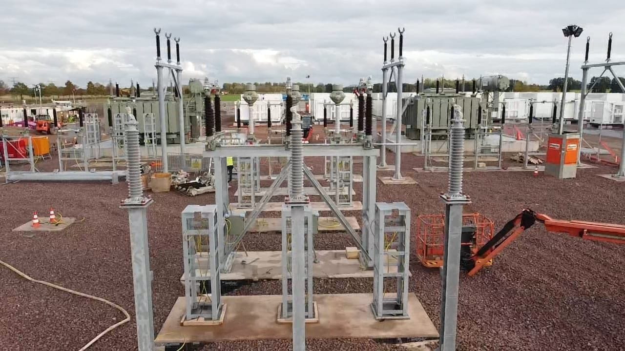 High-voltage steelwork, insulators and transformers under construction in a Maveric-built electrical compound.